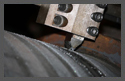 In situ trunnion journal grinding